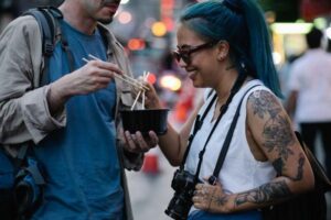 how to meet people while traveling alone